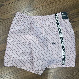 Nike men’s swim trunks. Color is a dull pink. New with tags, never worn.
